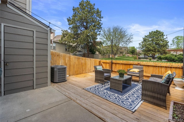 deck featuring cooling unit, an outdoor living space, and fence