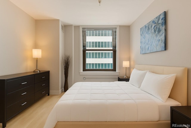 444 17th St Unit 701, Denver, CO 80202 - bedroom featuring light wood-type flooring and baseboards