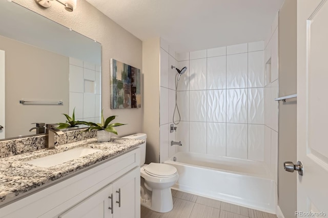 444 17th St Unit 701, Denver, CO 80202 - full bath featuring vanity, toilet,  shower combination, and tile patterned floors
