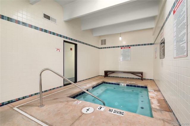 view of pool with an indoor in ground hot tub