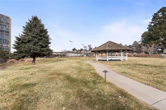 view of home's community with a gazebo and a yard