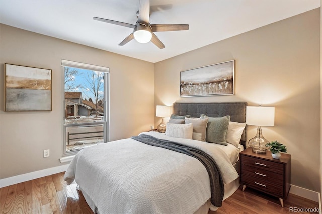 bedroom with ceiling fan and hardwood / wood-style floors