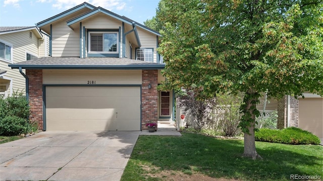 2181 E Phillips Ln, Centennial, CO 80122 - view of front of property with concrete driveway, brick siding, a garage, and a front lawn