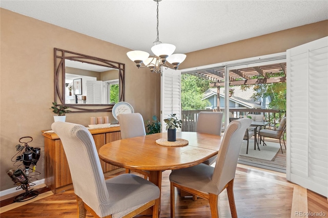 2181 E Phillips Ln, Centennial, CO 80122 - dining area featuring a chandelier and light wood-style flooring