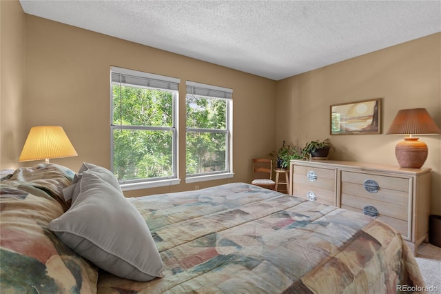 2181 E Phillips Ln, Centennial, CO 80122 - bedroom with a textured ceiling and carpet