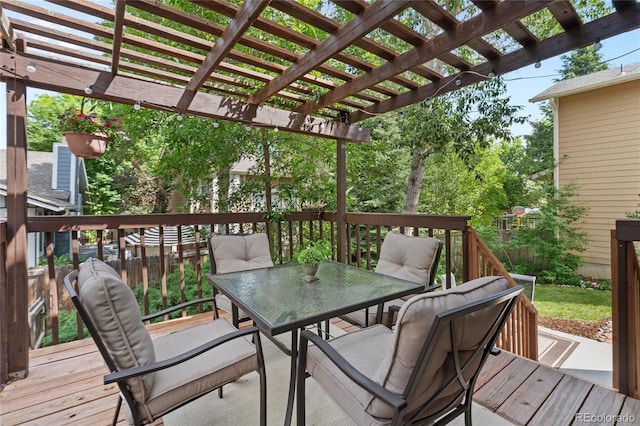 2181 E Phillips Ln, Centennial, CO 80122 - wooden deck with outdoor dining area and a pergola