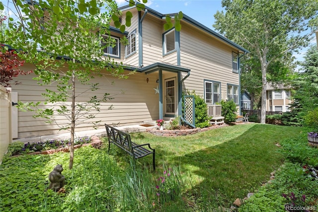 2181 E Phillips Ln, Centennial, CO 80122 - back of house featuring a lawn