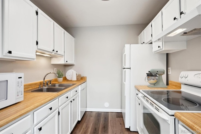 kitchen with sink, white appliances, dark hardwood / wood-style floors, and white cabinets