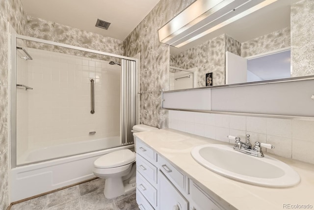 full bathroom with tasteful backsplash, tile patterned floors, vanity, shower / bath combination with glass door, and toilet