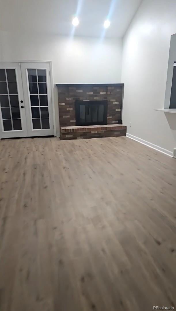 unfurnished living room featuring hardwood / wood-style floors