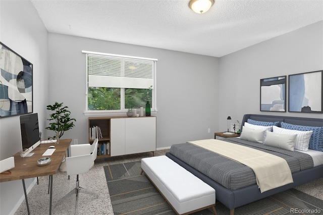 carpeted bedroom with a textured ceiling