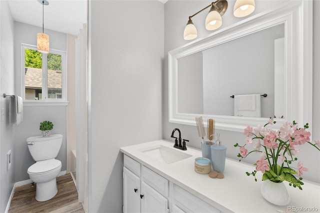 full bathroom featuring hardwood / wood-style flooring, vanity, shower / bath combination, and toilet