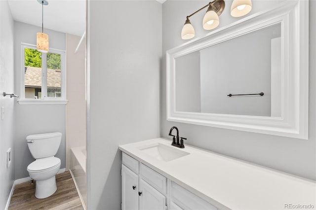 full bathroom with shower / tub combination, vanity, toilet, and wood-type flooring