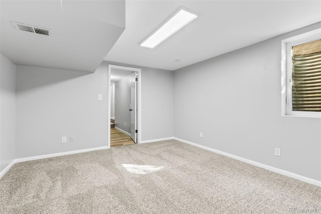 basement with light colored carpet