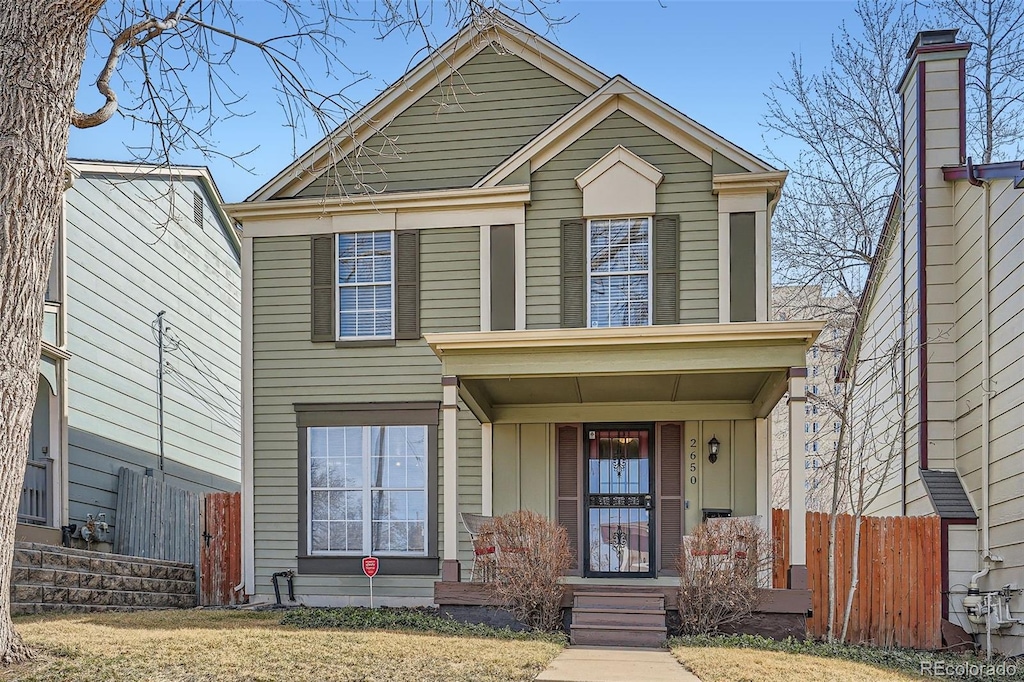 2650 Perry St, Denver, CO 80212 - traditional-style house featuring a porch and fence