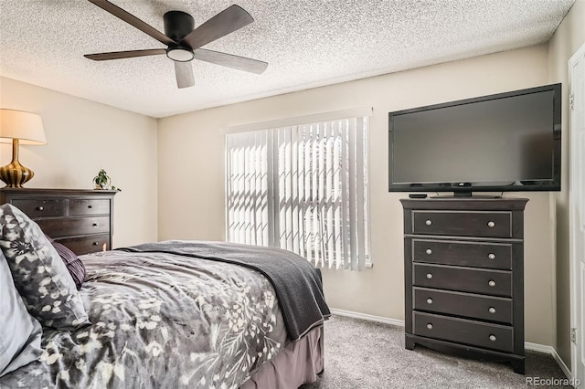 bedroom with baseboards, carpet floors, a textured ceiling, and ceiling fan