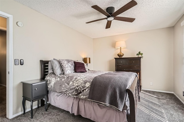 bedroom featuring baseboards, carpet, and a textured ceiling