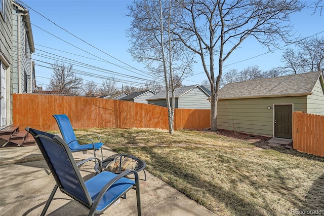 view of yard with a patio area, a fire pit, and fence