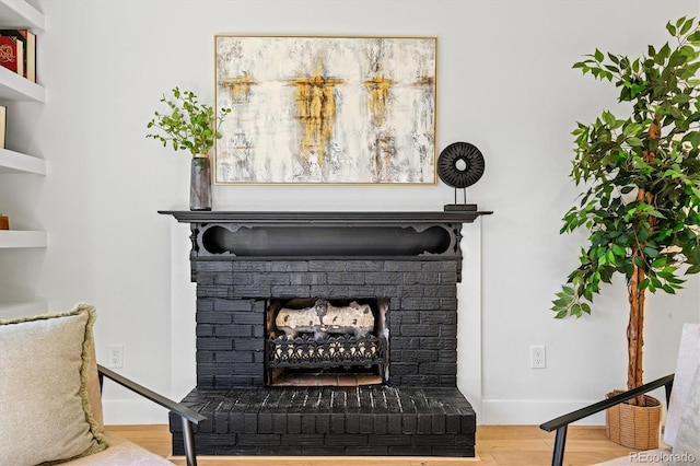 details featuring a fireplace and hardwood / wood-style floors