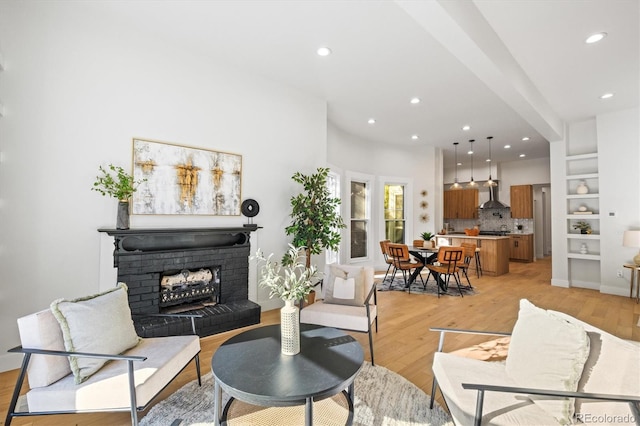 living room featuring light hardwood / wood-style floors and a fireplace