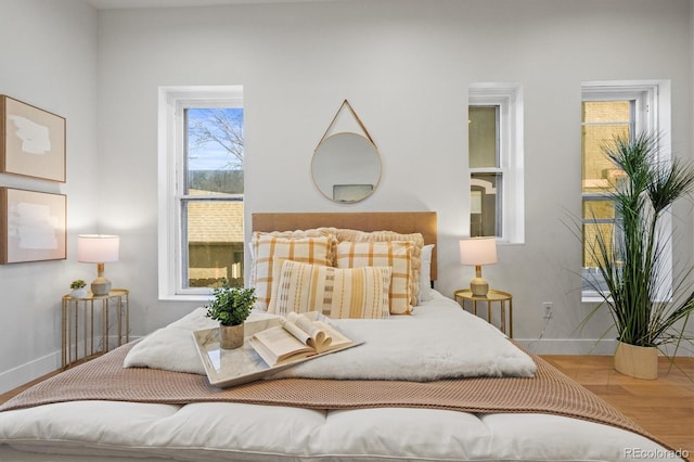 bedroom with hardwood / wood-style floors