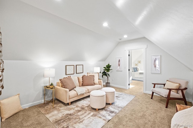 living room with vaulted ceiling and light colored carpet