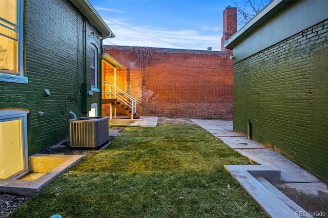 view of yard with central AC unit