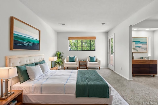 carpeted bedroom featuring baseboards