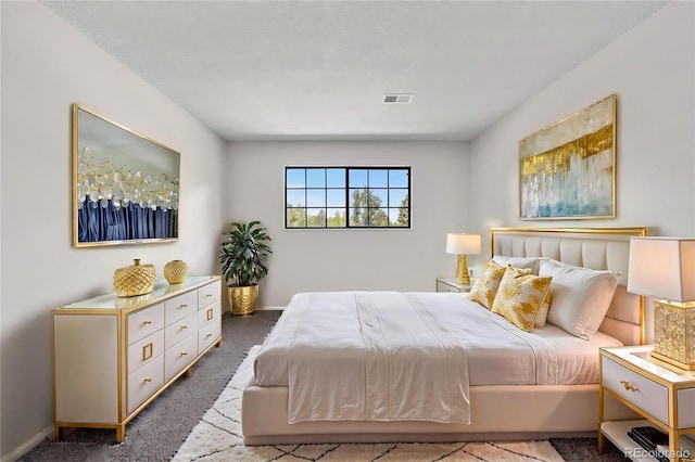 carpeted bedroom featuring baseboards