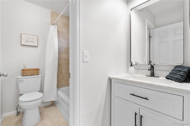 bathroom with tile patterned flooring, toilet, vanity, baseboards, and shower / bath combo