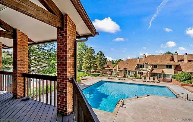 community pool featuring a residential view