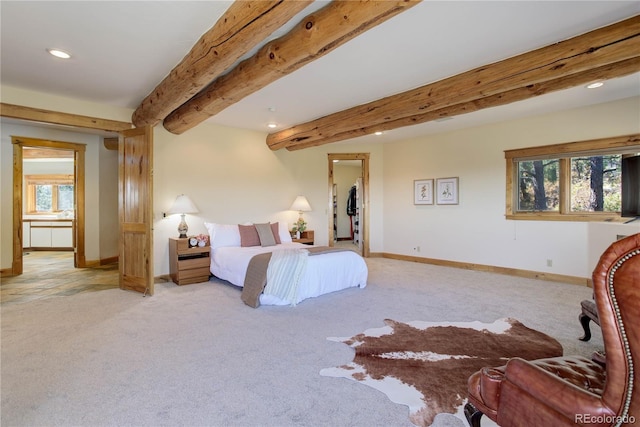 bedroom featuring baseboards, beam ceiling, recessed lighting, a spacious closet, and light carpet