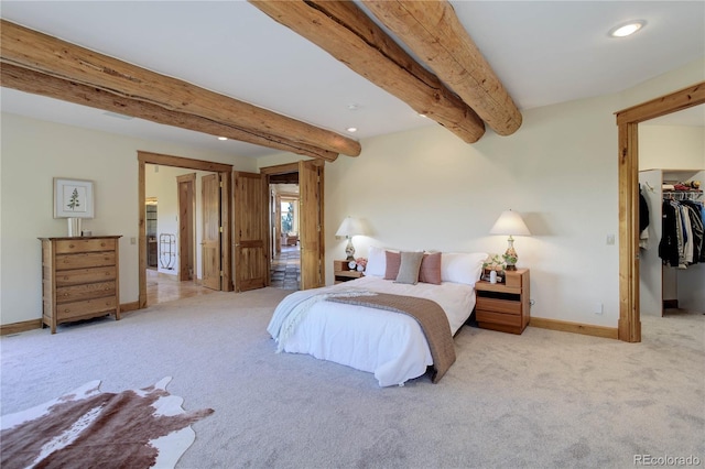 bedroom featuring carpet, baseboards, recessed lighting, a spacious closet, and beamed ceiling