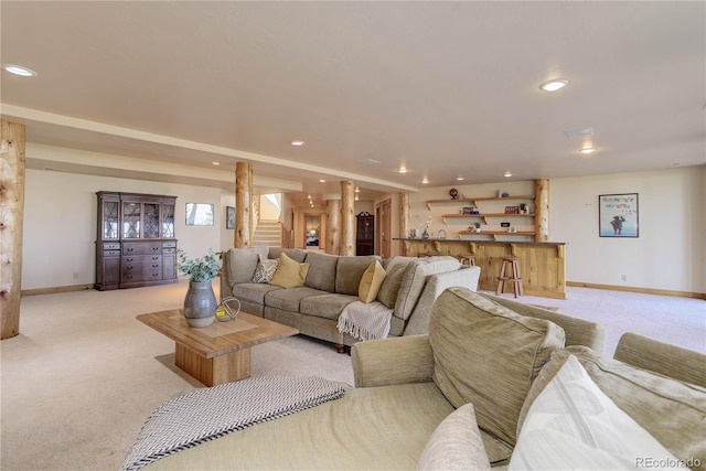 living area featuring stairway, recessed lighting, and light carpet