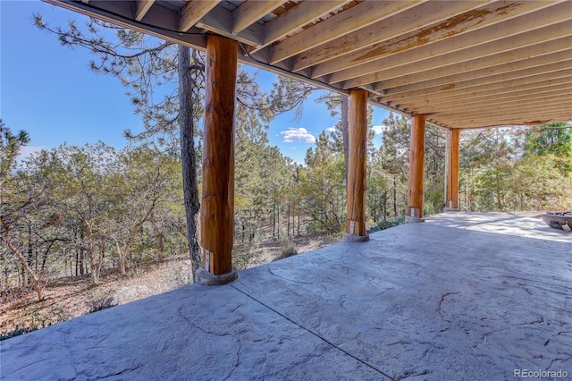 view of patio featuring a view of trees