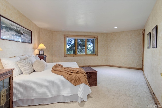 bedroom featuring baseboards, carpet flooring, and wallpapered walls