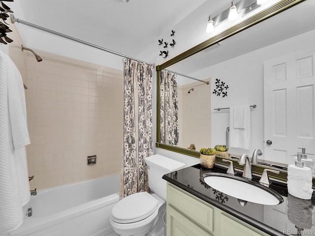 full bathroom featuring toilet, shower / bath combo with shower curtain, and vanity