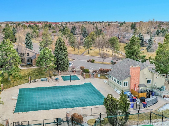 view of pool with fence and a residential view