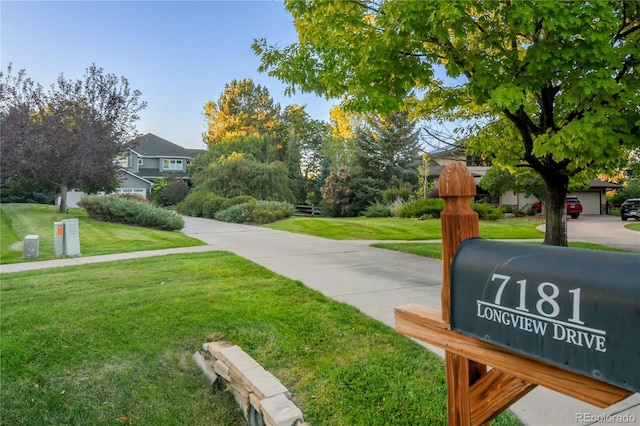 view of home's community featuring a lawn