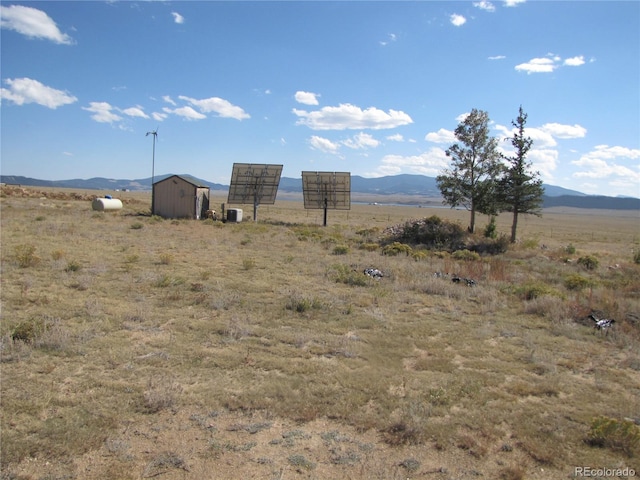 view of mountain feature with a rural view