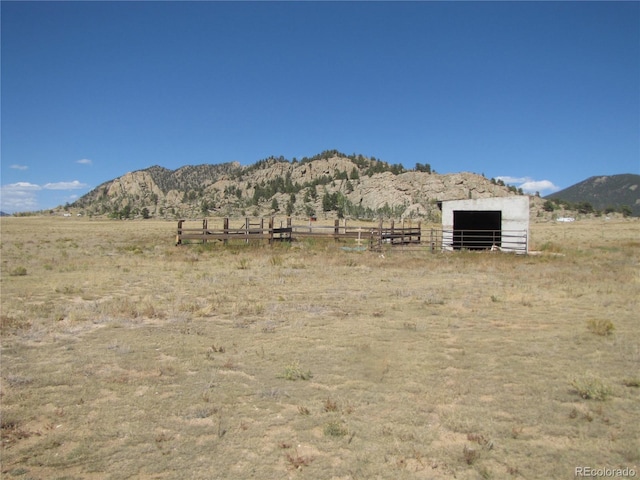 view of mountain feature with a rural view