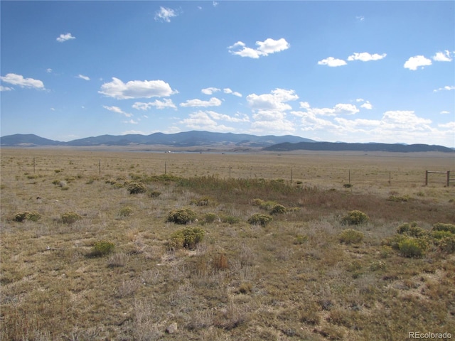 property view of mountains featuring a rural view