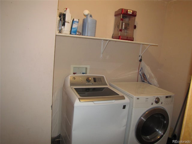 clothes washing area with washer and dryer