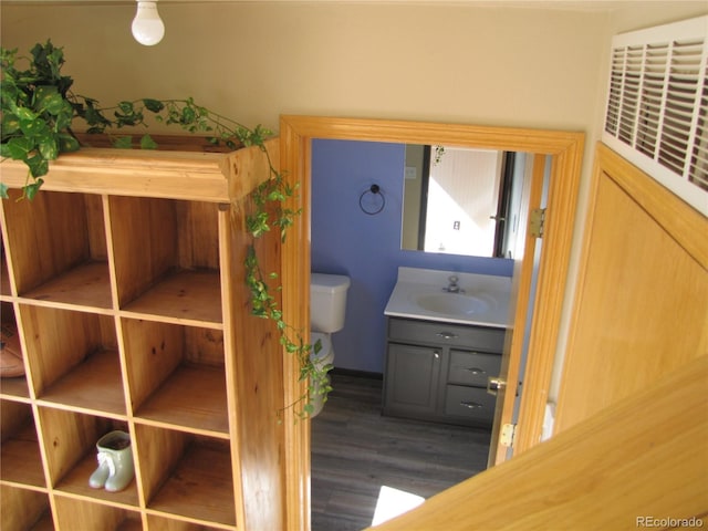 interior space with dark hardwood / wood-style flooring and sink