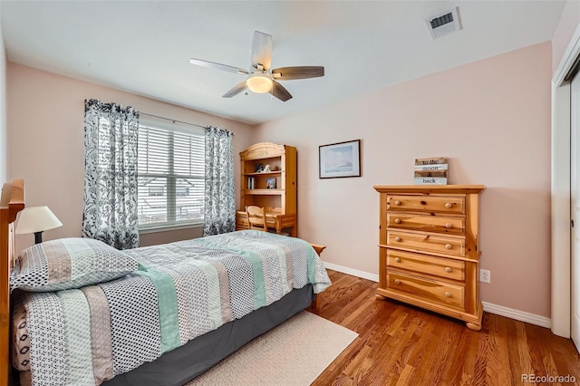 bedroom featuring wood-type flooring and ceiling fan