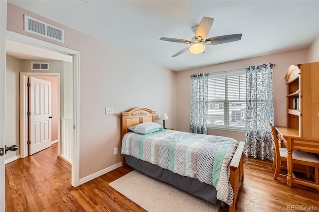 bedroom featuring hardwood / wood-style floors and ceiling fan