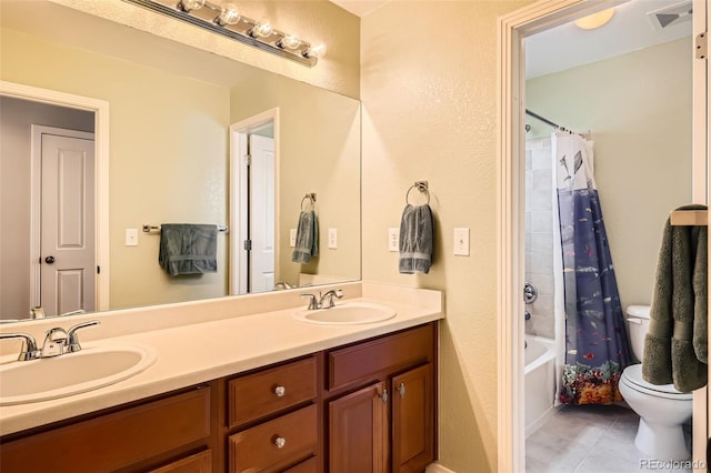 full bathroom featuring shower / tub combo with curtain, vanity, toilet, and tile patterned flooring