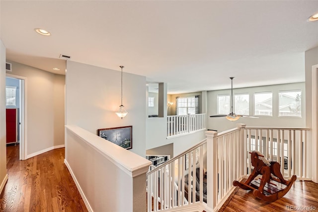 hall with dark hardwood / wood-style floors