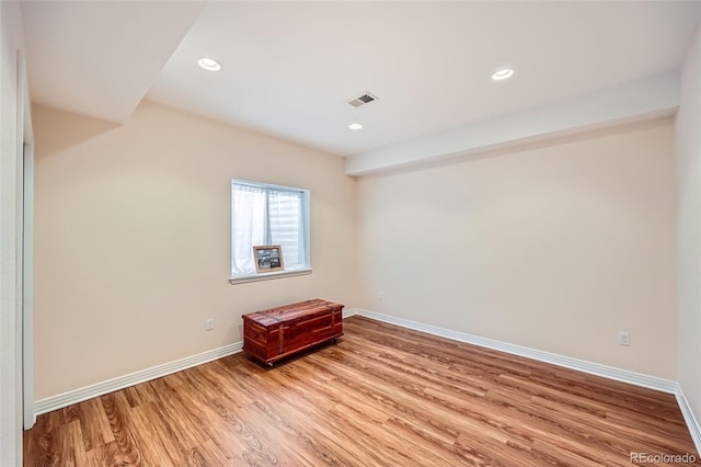 unfurnished room with light hardwood / wood-style floors