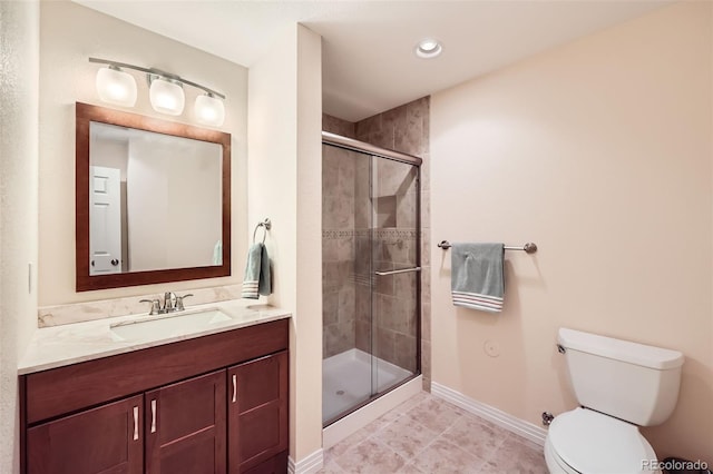 bathroom with walk in shower, vanity, and toilet